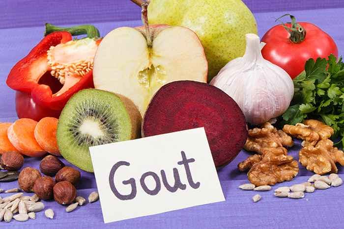 Fruits, nuts, seeds with a board displaying “gout”