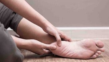 Woman pressing her left heel