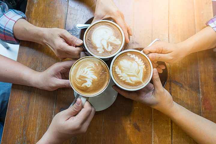 A group of people getting together and drinking coffee