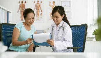 Doctor with a patient at the clinic, explaining test results 