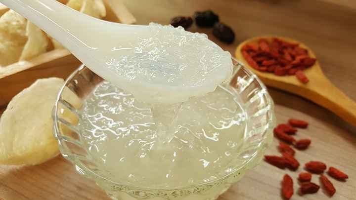 Edible birds nest soup in clear glass bowl