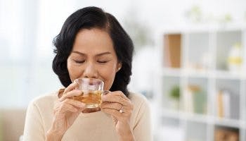 Elderly women drinking herbal tea while feeling content