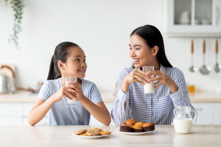 Mother and daughter spending time together over breakfast