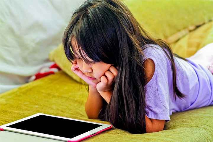 Girl watching a video on a mobile tablet