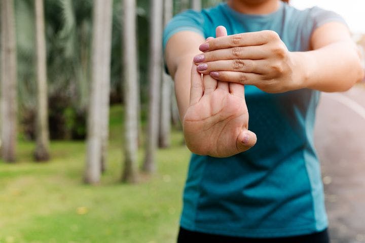 Person stretching their fingers