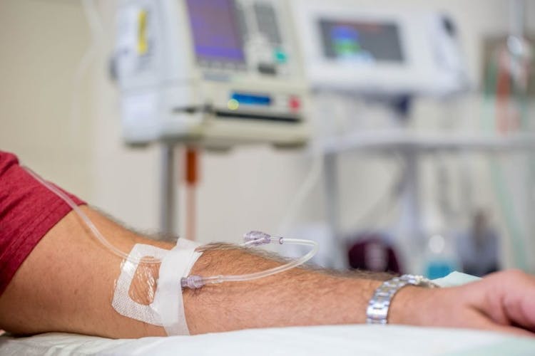 Man undergoing IVIG treatment at a healthcare facility