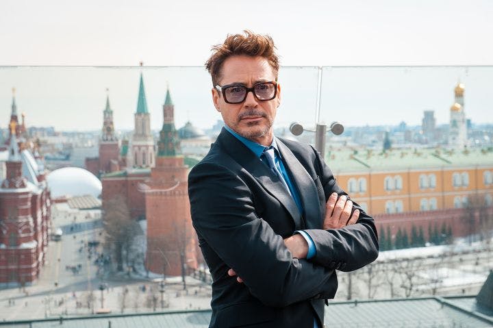 Close-up of Robert Downey Jr. posing for a photo with his arms folded as he stands on a roof in Moscow, Russia.