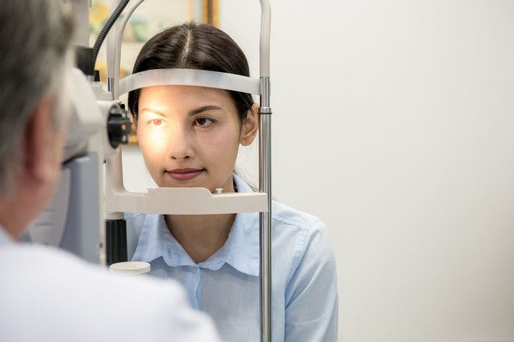 Woman having her eyes examined by an optometrist.