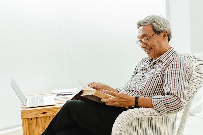 Asian elder happy enjoy to reading a book