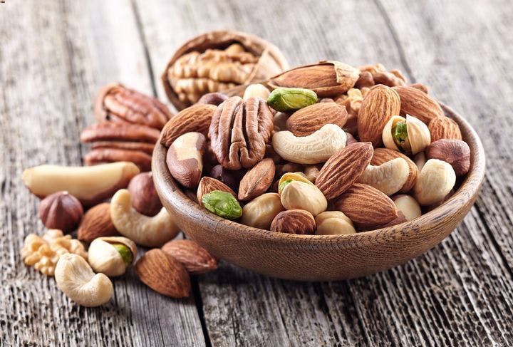Assorted nuts in a wooden bowl