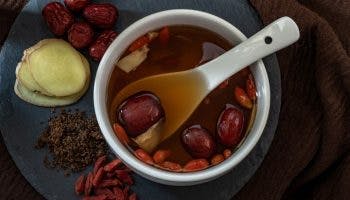 Confinement food jujube in a bowl as soup or tea with dried jujube, red dates, ginger, and brown sugar on the side