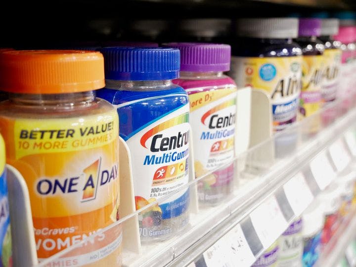 Popular multivitamin brands stocked on shelf in