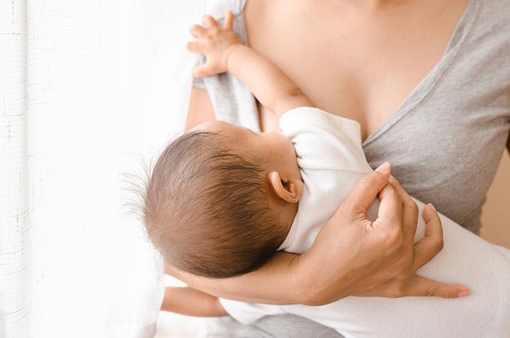 Woman breastfeeding her child