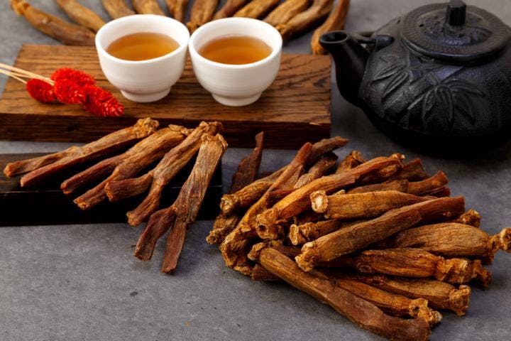 Slices of dried red ginseng to treat erectile dysfunction laid on a table