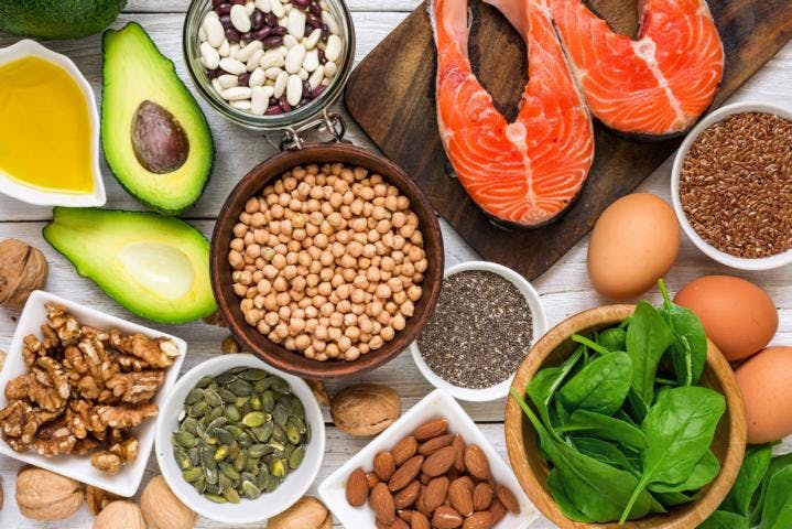 A variety of food rich in omega-3 fatty acids sit on a kitchen table