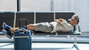 Jet lag guy in airport min scaled