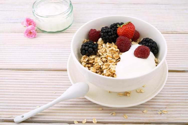 A bowl of yogurt with fresh berries and granola