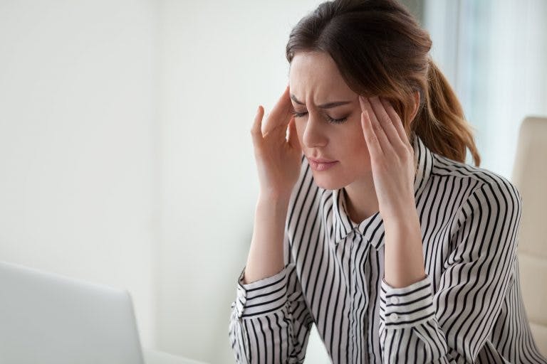 Migraine symptoms may include a headache, vision problems, and dizziness.